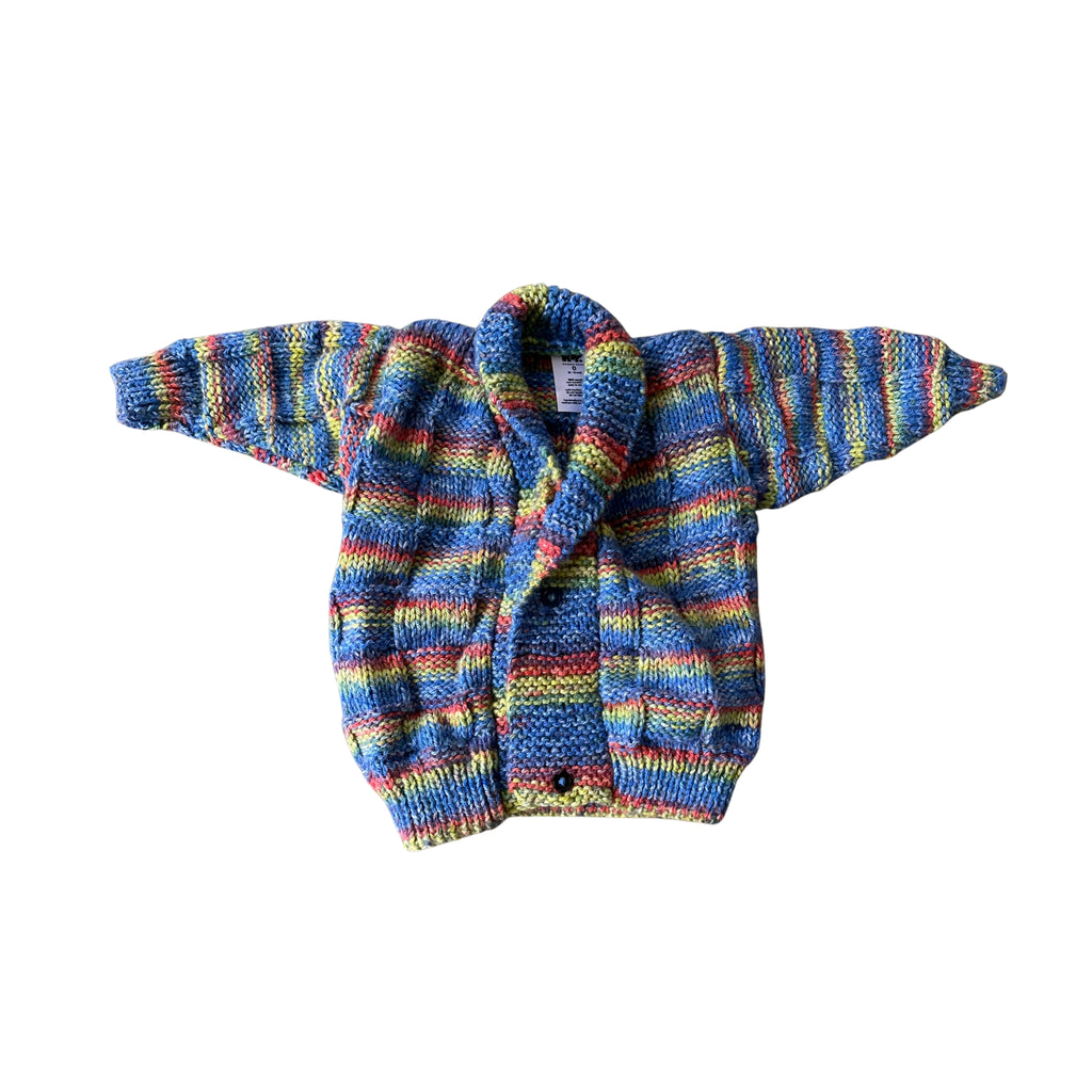 Colorful striped sweater on a white background